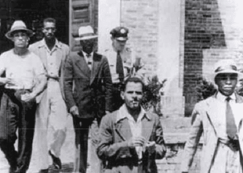 August 21, 1939. Arrest of five young Black men for peaceful protest at the whites-only "public" library in Alexandria, Va.