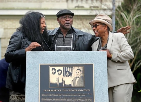 Relatives of the Groveland Four, including Carol Greenlee, right, gather at a monument that was unveiled in front of the Old Lake County Courthouse in Tavares, Fla., on Feb. 21, 2020.