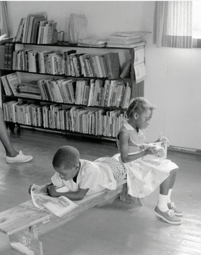 Children read in a freedom library in Mississippi