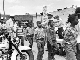 Police send a group of African American school children to jail in Birmingham, Ala. on May 4, 1963. (Bill Hudson/AP)