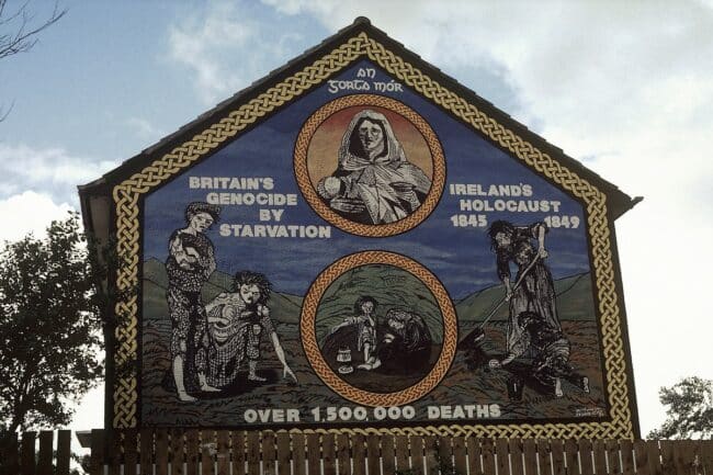 A mural on Whiterock Road in Belfast commemorating the Irish famine. The mural reads "Britain's genocide by starvation. Ireland's holocaust, 1845-1849. Over 1,500,000 deaths."