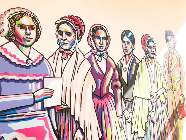 Mural by Blake Chamberlain on an interior wall of the Women's Rights National Historical Park Visitor Center depicting influential people of the women's suffrage movement. 