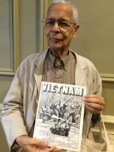 Julian Bond holding Vietnam Comic Book | Zinn Education Project