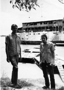 Mutineers Clyde McKay and Alvin Glatkowski outside the prison ship on the Mekong River