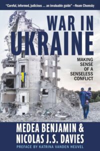book cover showing a father holding his child on a wartorn street in Ukraine.
