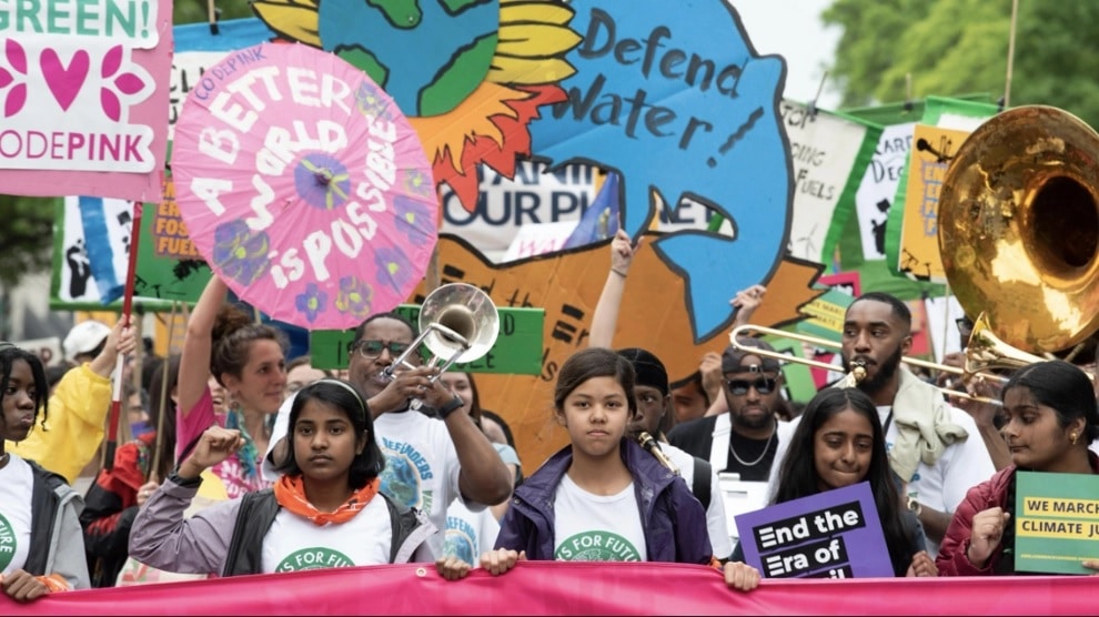 Young people marching and rallying for climate justice.