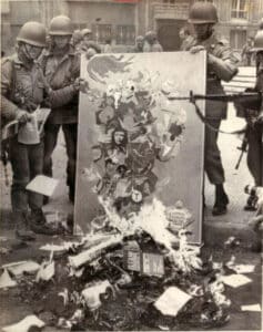 Right-wing soldiers burning Marxist literature during the 1973 coup in Chile.