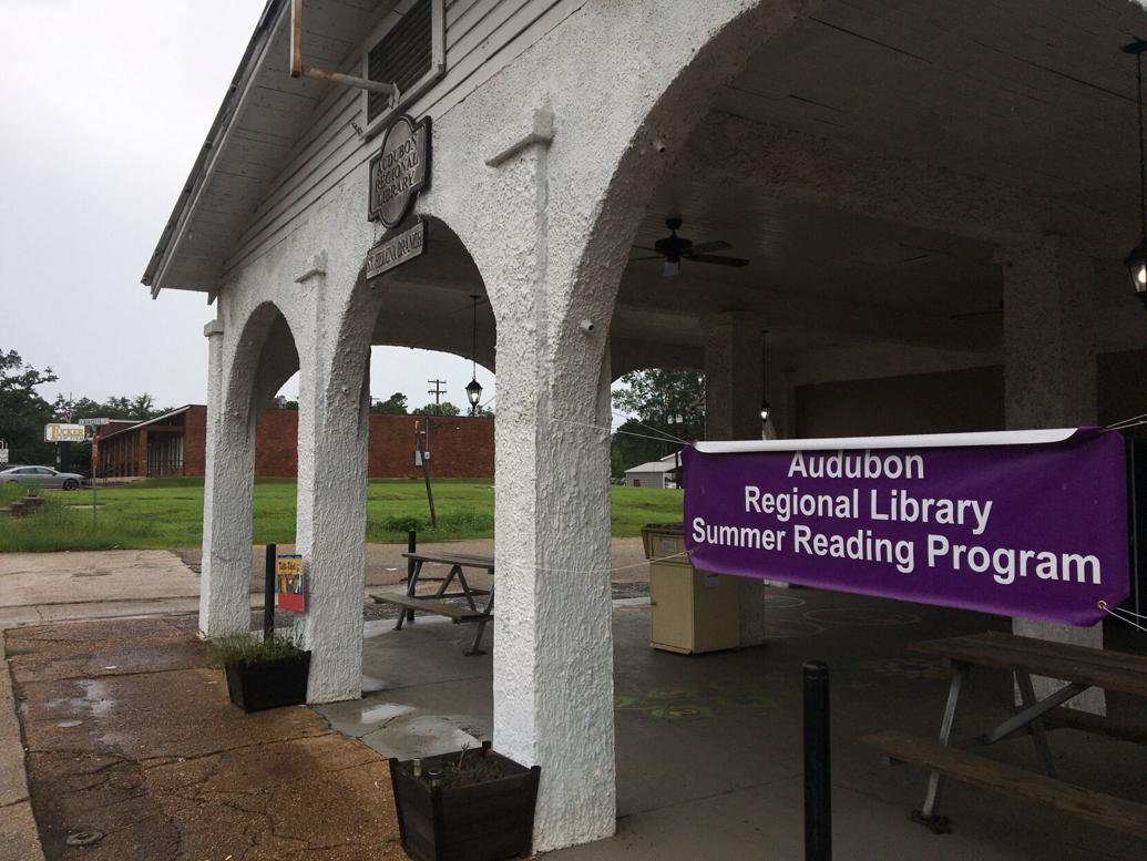 A sign for the Audubon Library Summer Reading Program at the library's St. Helena Parish branch beckons residents in Greensburg.